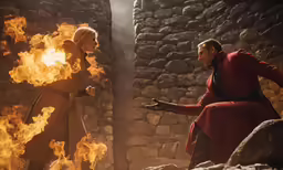 a man and woman are shown in front of a fire