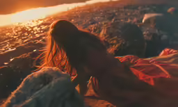 the woman is alone on the beach next to the surf