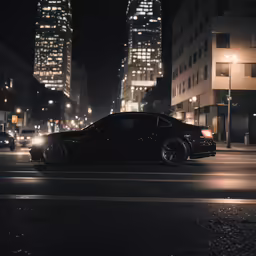 an elegant black car is driving through the dark street