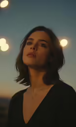 a close up of a person wearing black in the sun