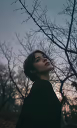a person that is standing up in a field