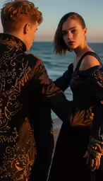 an image of two people standing on the beach