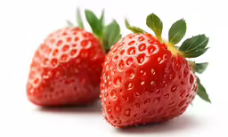 there are two strawberries next to each other