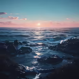 an ocean view with waves and some rocks at the shore