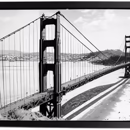 a black and white photograph of the side of the bridge