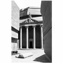 the front view of a building with some columns