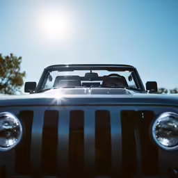 a jeep is shown as it looks out into the sunlight