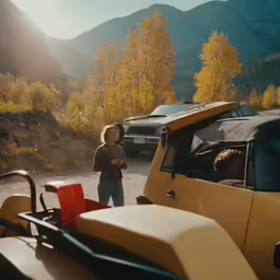 there are some cars parked in the lot next to a woman