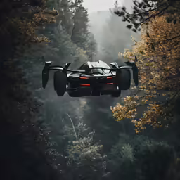a bugatti is flying over a forest with a trail