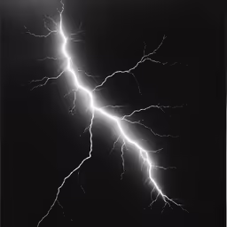 lightning striking through the dark sky over a building