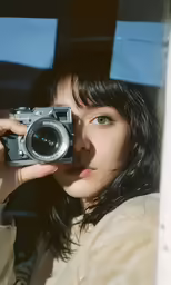 a woman taking a photo with her camera