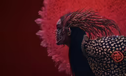a man wearing a dress made of animal skin and feathers