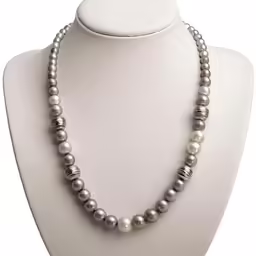 a large necklace with a silver clasp