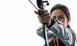 woman aiming her archery rifle with her hand