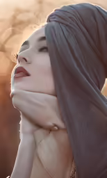 a woman with her hand on her head with the sun in the background