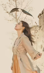 a woman standing in front of some birds