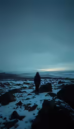 a man is walking along a snowy slope