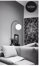 a black and white photo of a room with a couch