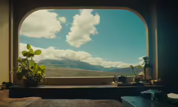 window in room with mountains and clouds on the windowsill
