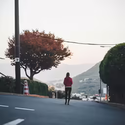 a man riding a skateboard down a street