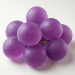 small balls of purple grape in a group on white background
