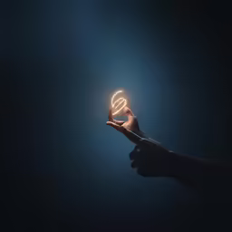 a person holding a glowing object in their hand