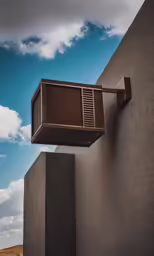 the corner of a building with a large window on it