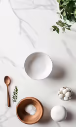 a bowl, spoon and bowl with some kind of ingredients