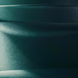 closeup shot of a dark green, shiny material