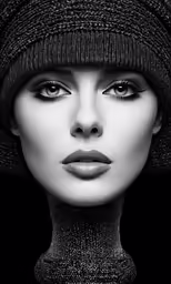 a black and white photo of a woman with large eyes