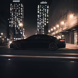 the black car is parked in the city