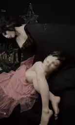 a naked young woman laying on top of a couch