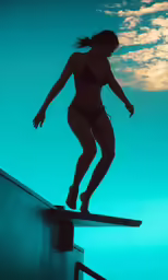 the girl is standing on a ledge while standing on her board