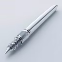 a silver pen is shown on a white surface