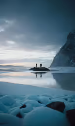 two people walking along the beach in winter