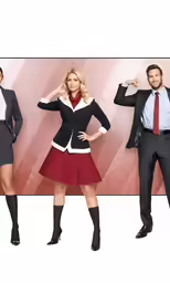 two people in business attire standing together