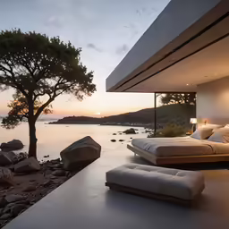 a bedroom with the view of a calm beach at sunset