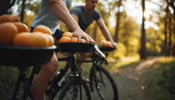 a man riding a bike down a dirt road