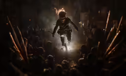 a man dressed in armor running towards the crowd