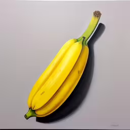a group of three ripe bananas hanging on a wall