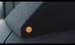 a black object that has a yellow circle on it