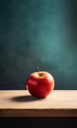 an apple on a wooden table by the wall