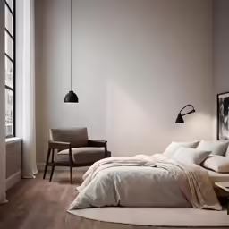 a bedroom with a bed, chair and window