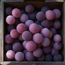 this photo shows different shades of plums in a wooden box