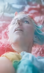 the woman is lying down in the water