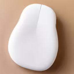 a white computer mouse is sitting on a surface
