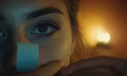 a woman putting a card into her blue eye