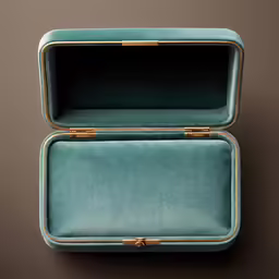a green velvet jewellery box with gold hardwares