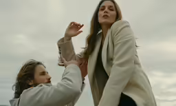 a young man reaching out for a woman