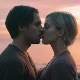 two people that are standing next to each other